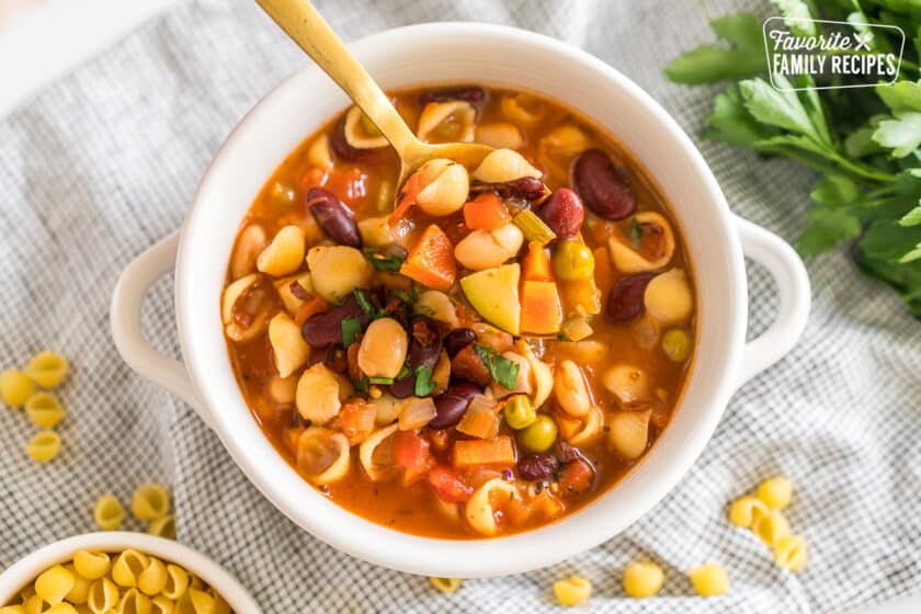 a spoonful of Minestrone soup from a bowl