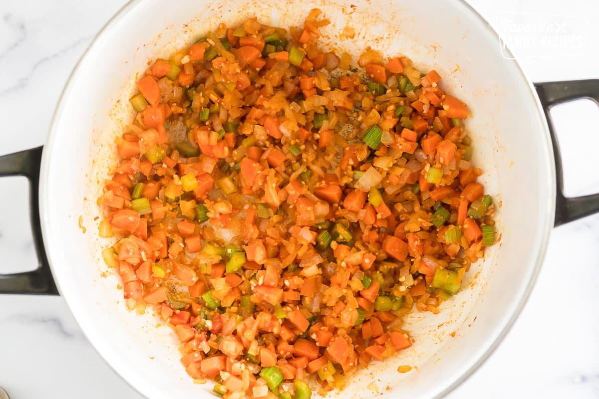 soffrito in a pot with tomato paste