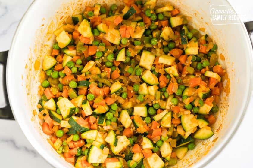 veggies sautéing in a pot