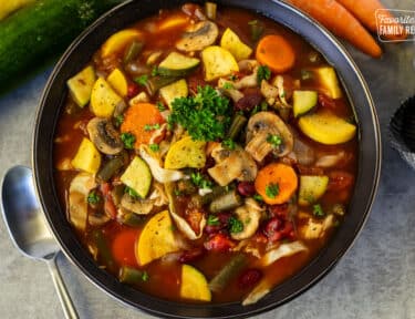 Large bowl of Weight Loss Magic Soup garnished with parsley.