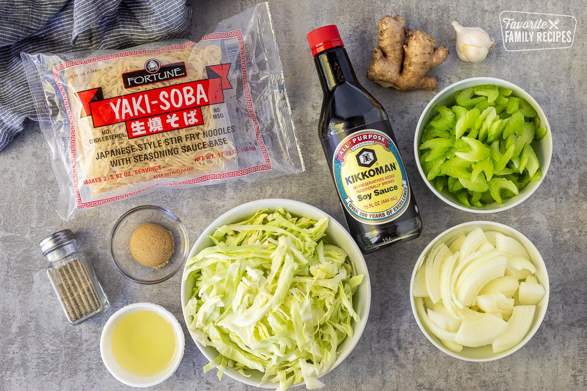 Ingredients to make Panda Express Chow Mein including soy sauce, celery, onion, ginger, garlic, cabbage, oil, brown sugar, Yaki-Soba noodles and pepper.