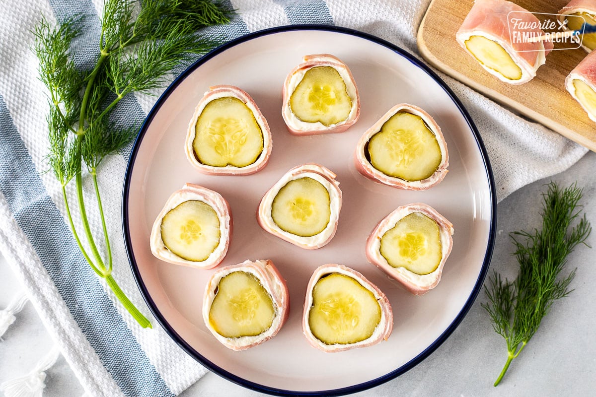Plate with eight Ham Roll Ups with Pickle.