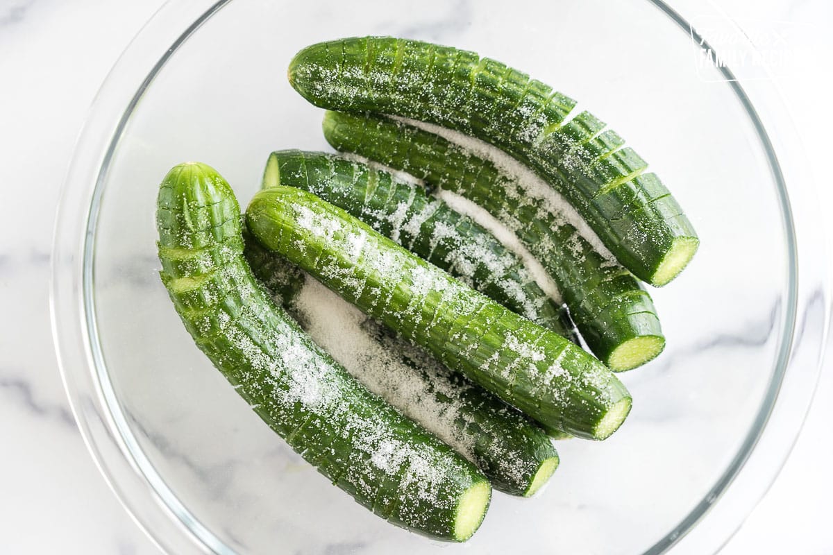 cucumbers sitting in salt in a bowl