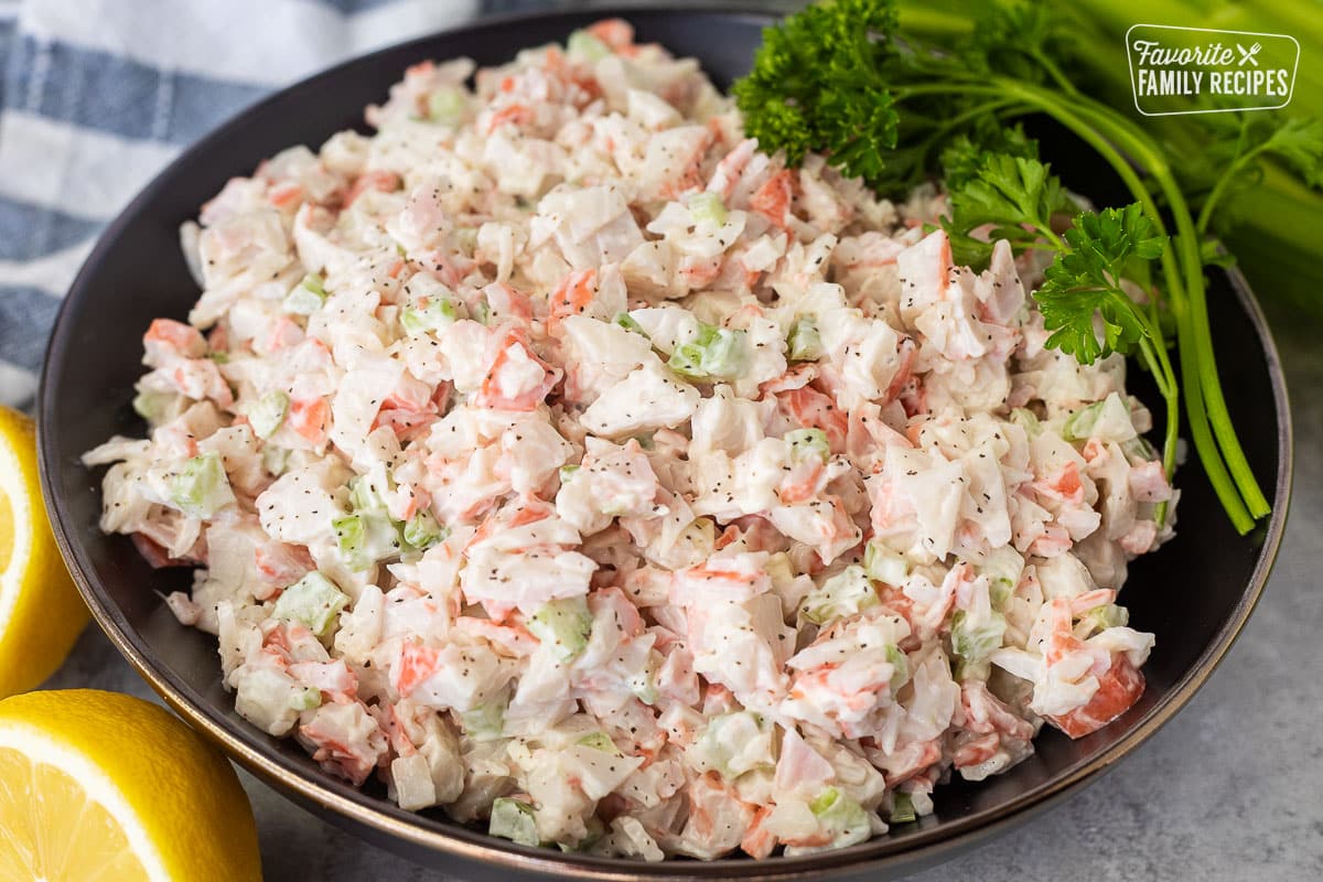 Crab Salad in a large bowl garnished with parsley.