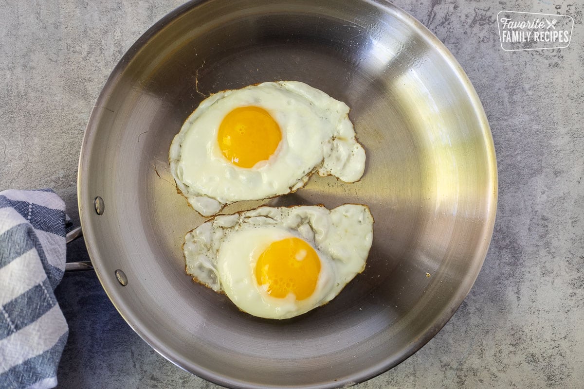 Skillet with two sunny side up eggs.