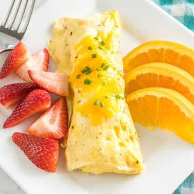 Omlette in a Bag on a plate with fresh fruit