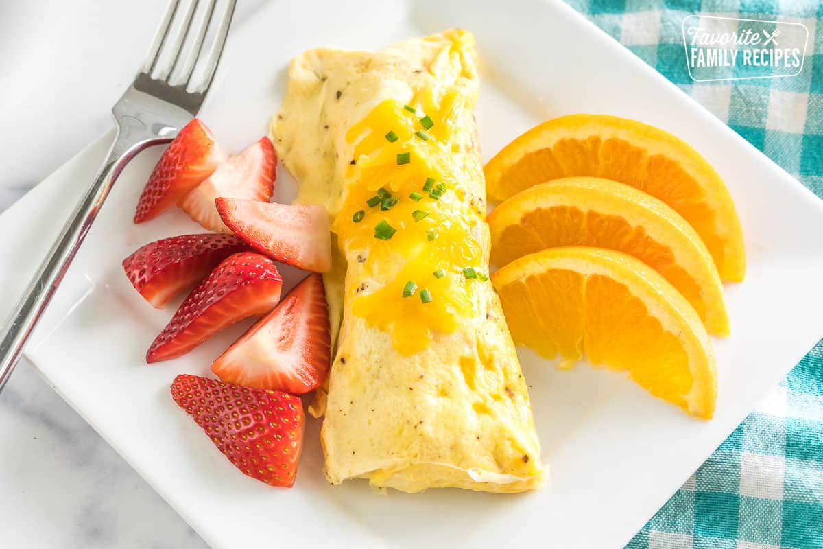 Omlette in a Bag on a plate with fresh fruit