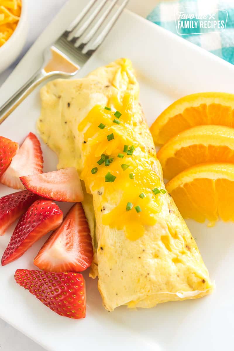 Omelette in a Bag on a plate with fresh fruit