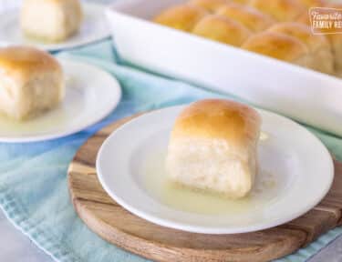 Pani Popo on a plate with dish of Pani Popo in the background.