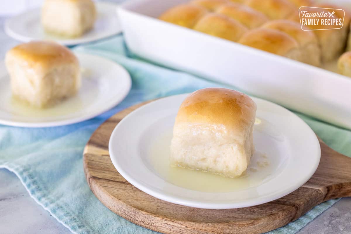 Pani Popo on a plate with dish of Pani Popo in the background.