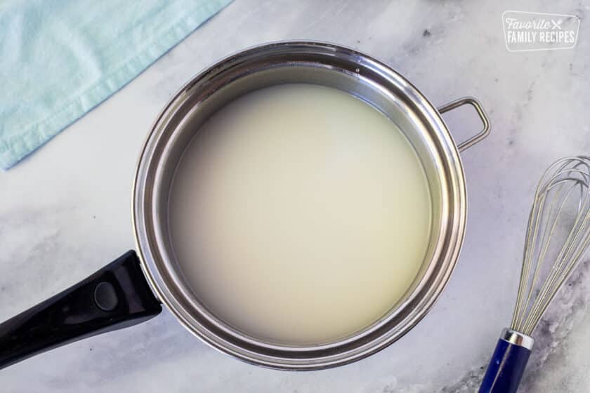 Saucepan of coconut sauce for Samoan coconut rolls or Pani Popo.