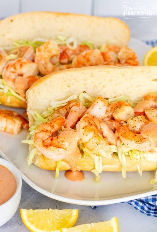 Two Shrimp Po'Boy Sandwiches on a plate.
