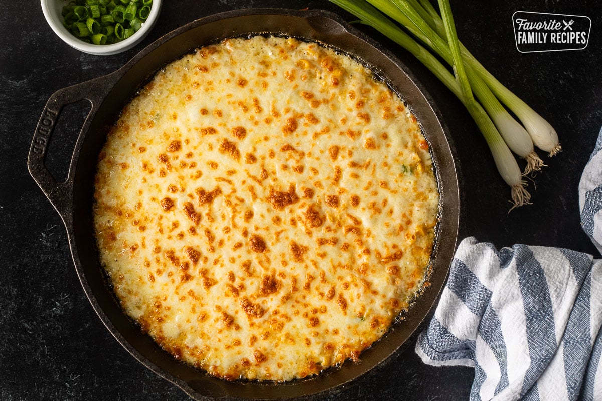 Baked Corn Cheese in a skillet.