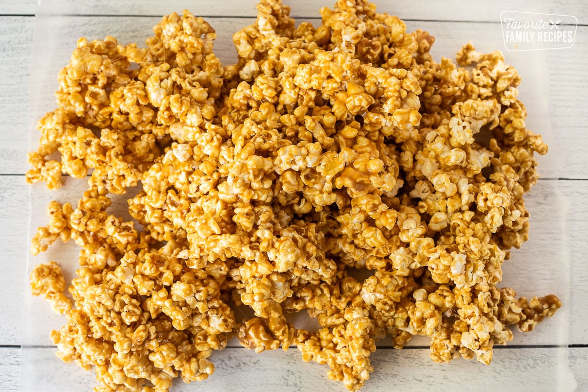 Caramel popcorn cooling on waxed paper.