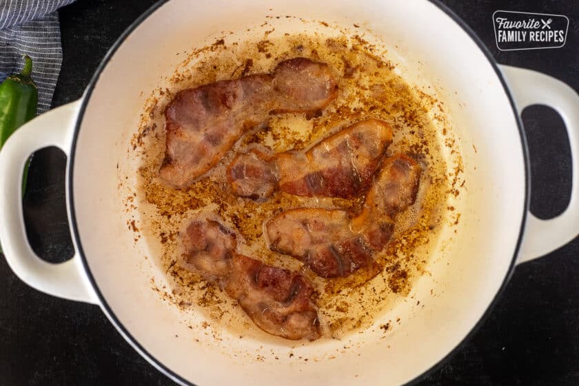 Cooking bacon in a dutch oven.