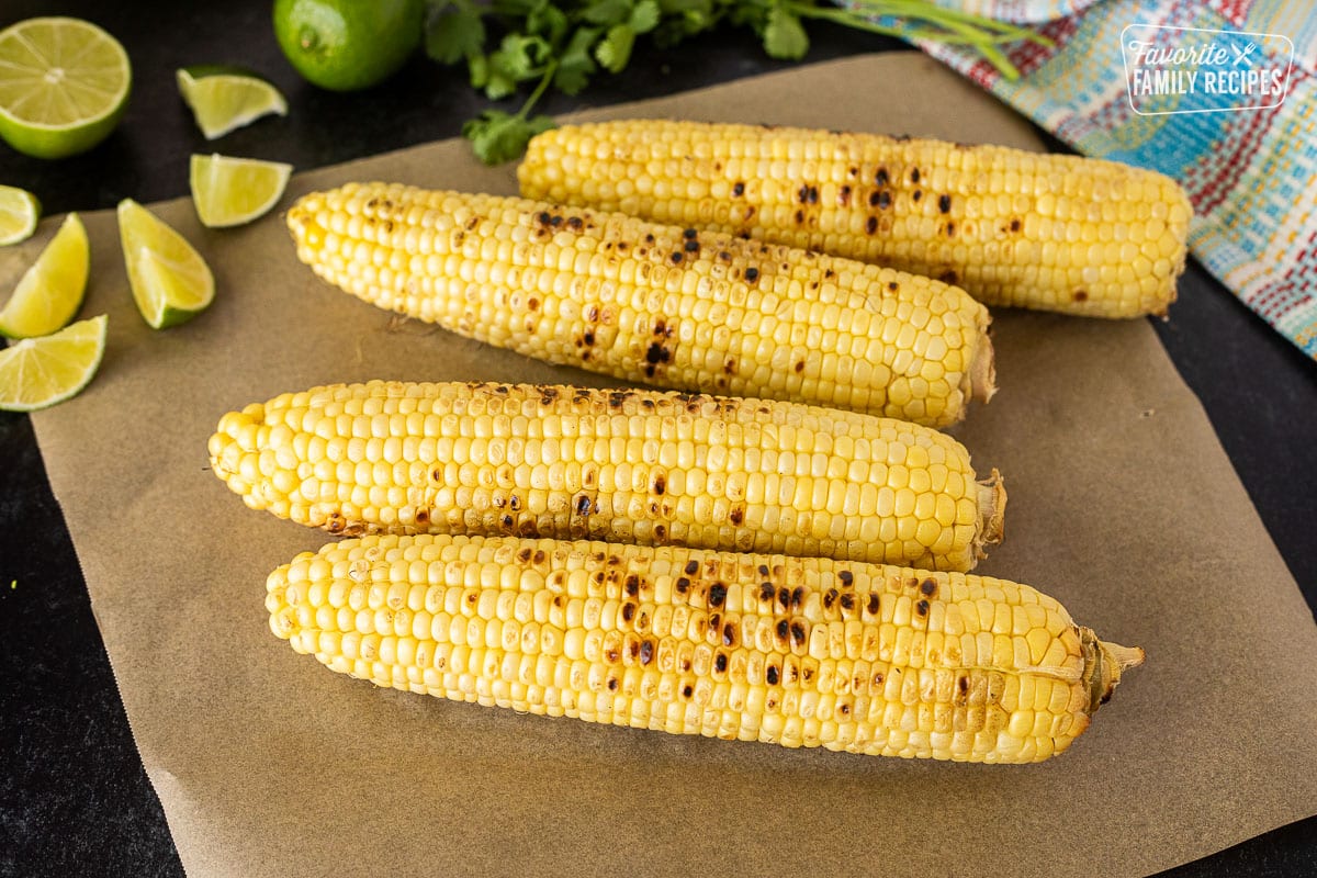 Four ears of grilled corn.