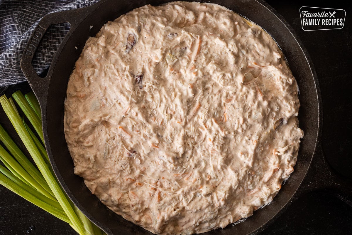 Spread hot crab dip in a skillet.