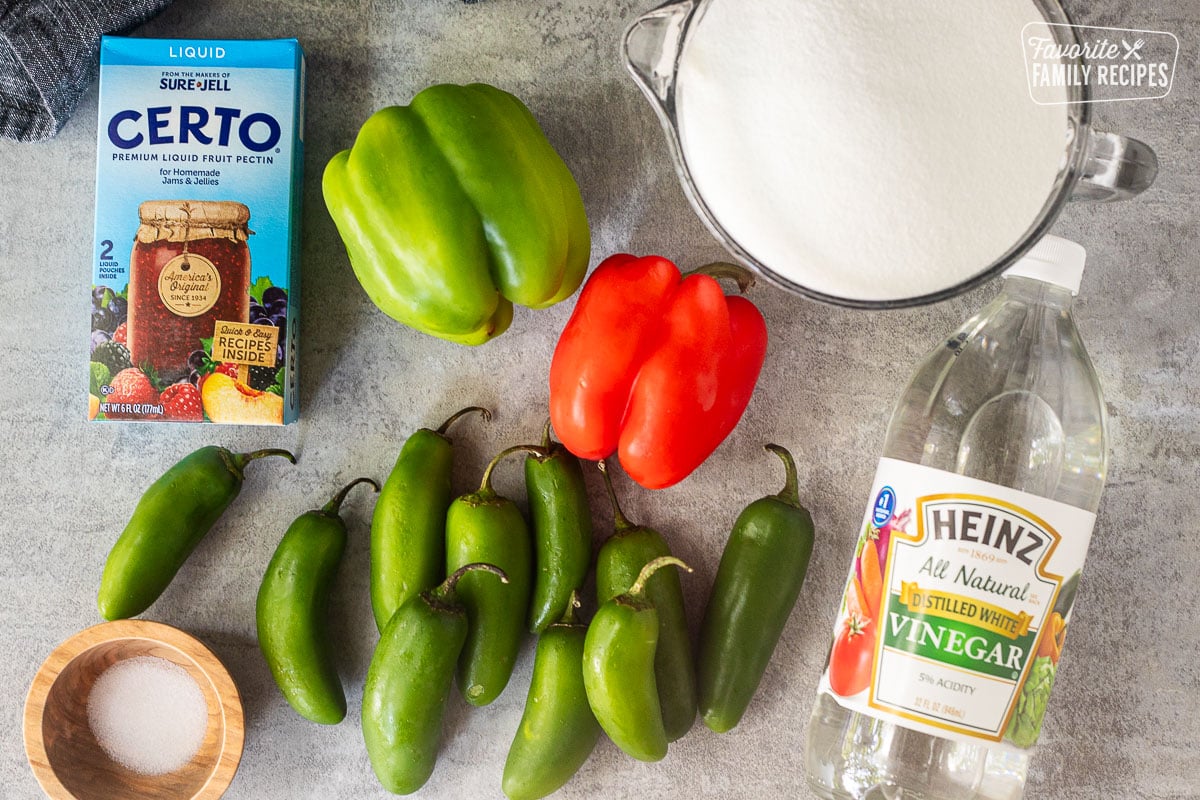 Ingredients to make Jalapeno Pepper Jelly including jalapeños, green bell pepper, red bell pepper, sugar, vinegar, salt and liquid pectin.