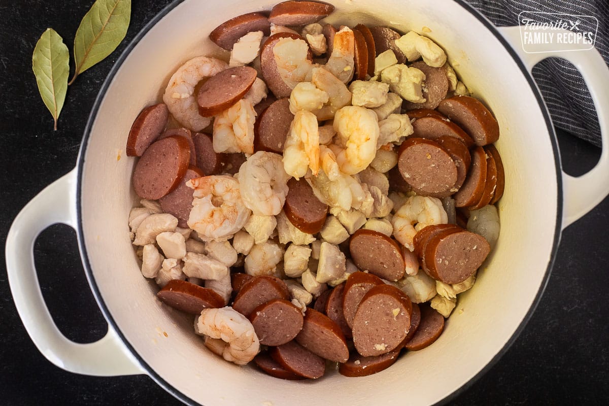 Dutch oven with combined sausage, chicken and shrimp.