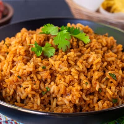 Homemade Mexican Rice with fluffy texture and cilantro garnish.