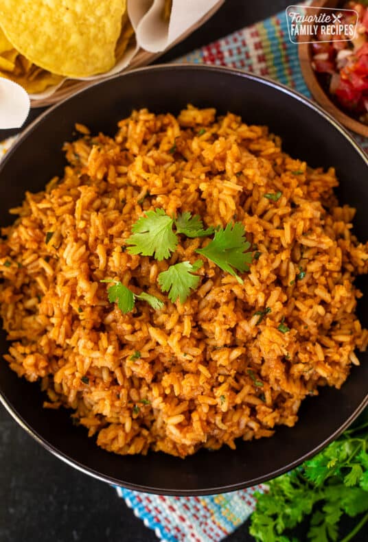 Easy Mexican Rice recipe, bowl of cooked rice with cilantro.