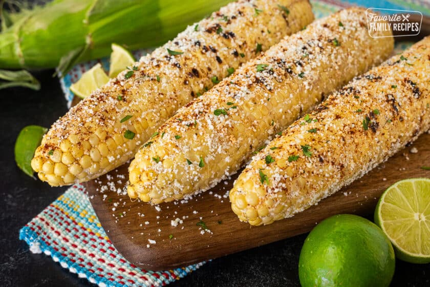 Three lined up pieces of Mexican Street Corn.