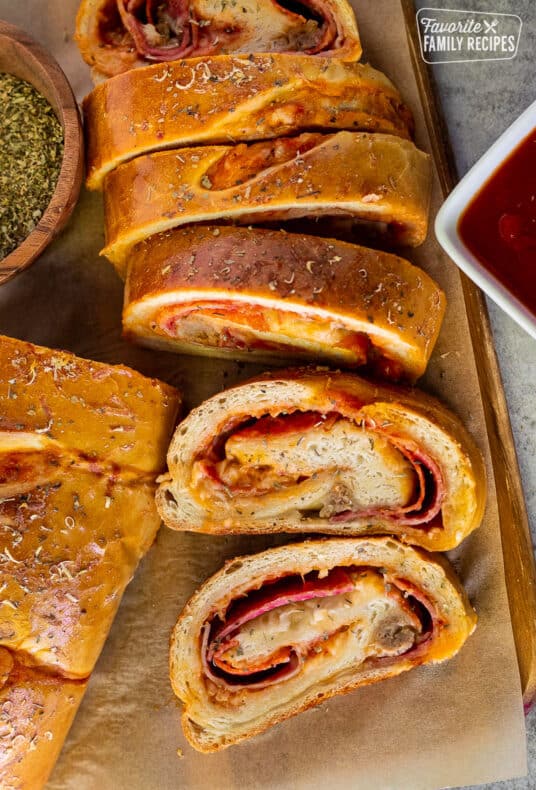 Slices of Stromboli with pizza sauce.