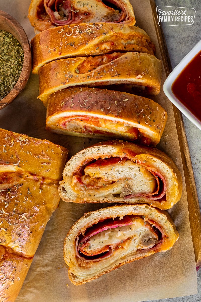 Slices of Stromboli with pizza sauce.