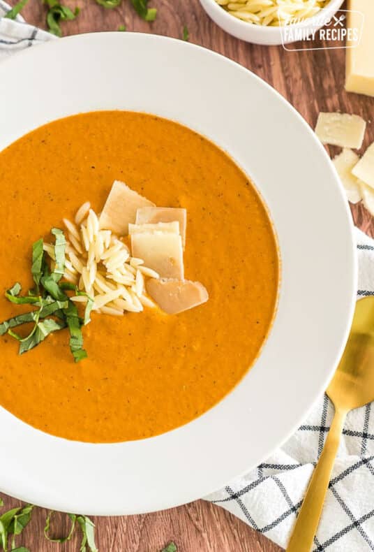 A bowl of zupas tomato basil soup.