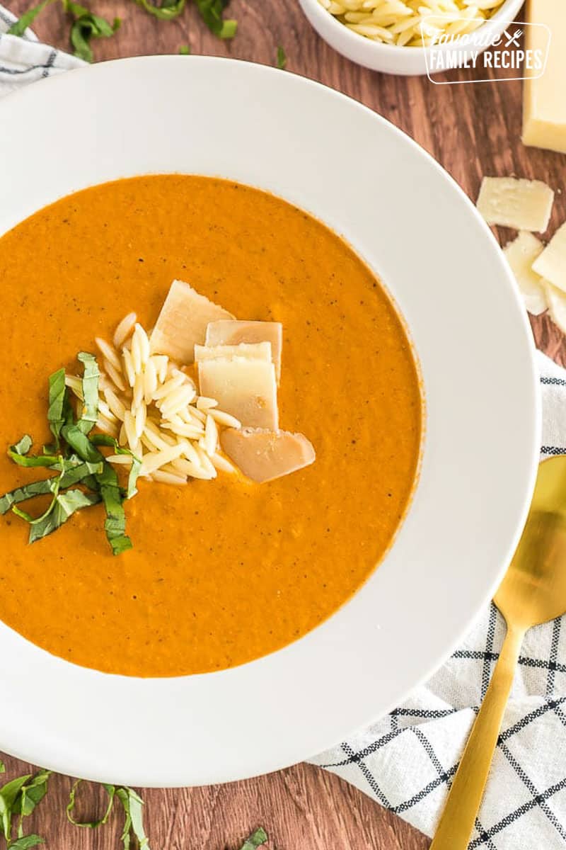 A bowl of zupas tomato basil soup. 