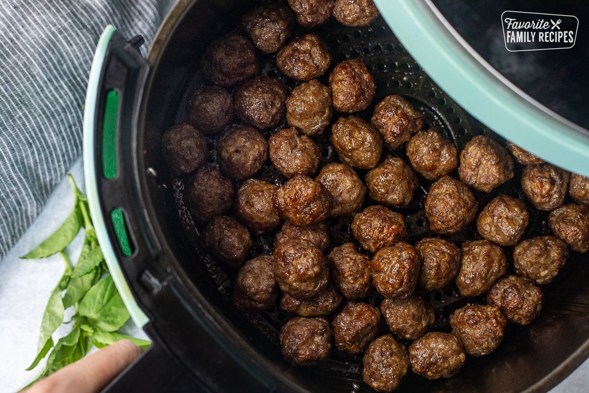 Pulling out Air Fryer Meatballs.