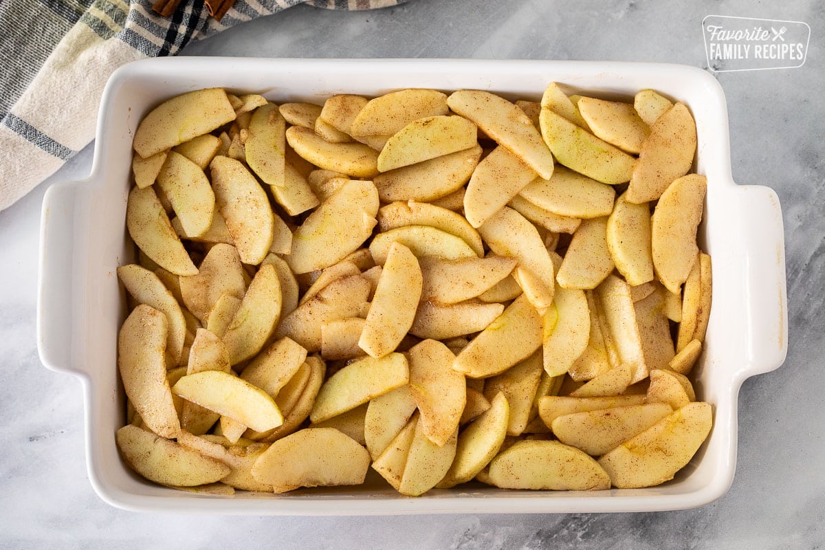 Baking dish with Apple Crisp apples.