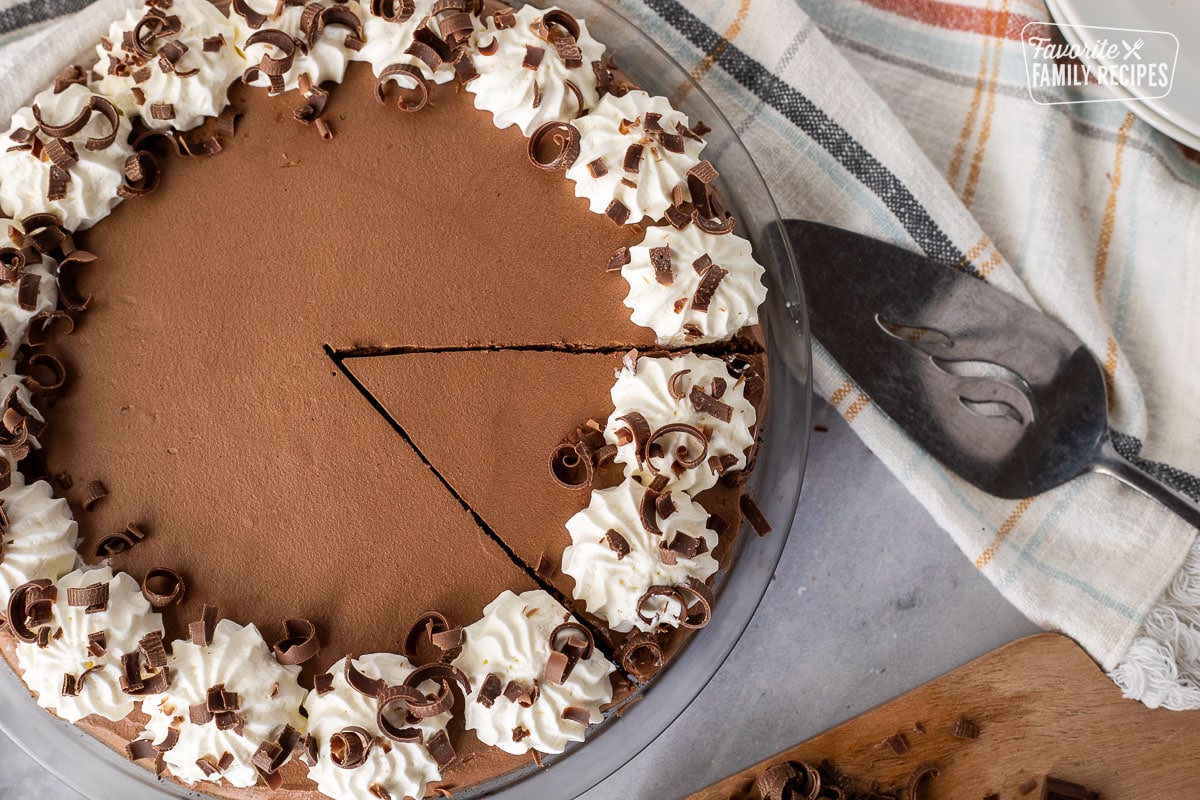 Cut slice of Chocolate Satin Pie with a pie server.