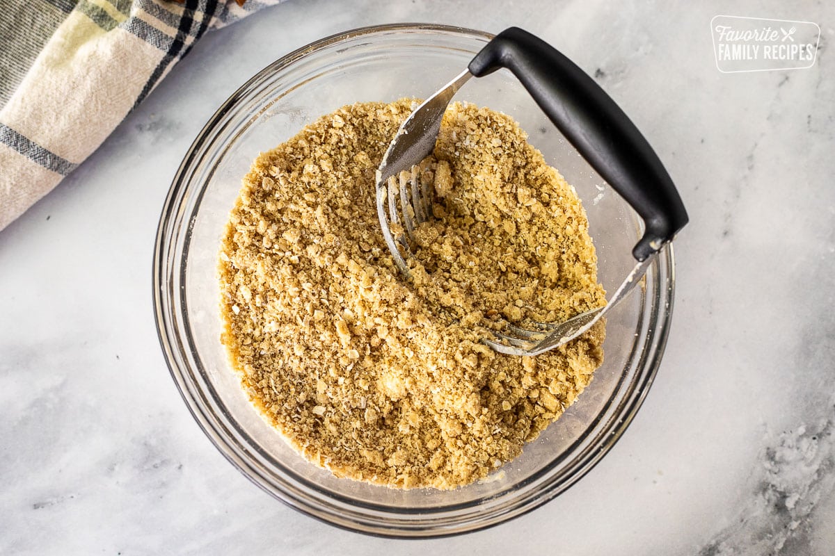 Mixing bowl with a blending tool for the Apple Crisp crumb topping.