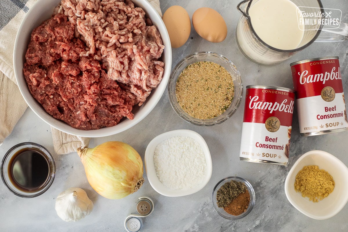 Ingredients to make Crock Pot Swedish Meatballs including ground beef, ground pork, beef consumme, heavy cream, seasoning, onion, garlic, worchester sauce, seasonings, eggs, salt, pepper, corn starch and ground mustard.