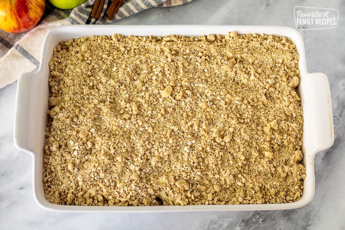 Baking dish of unbaked Apple Crisp.