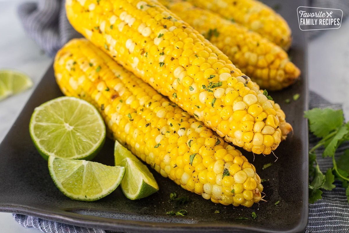 Grilled corn on the cob with lime and cilantro.