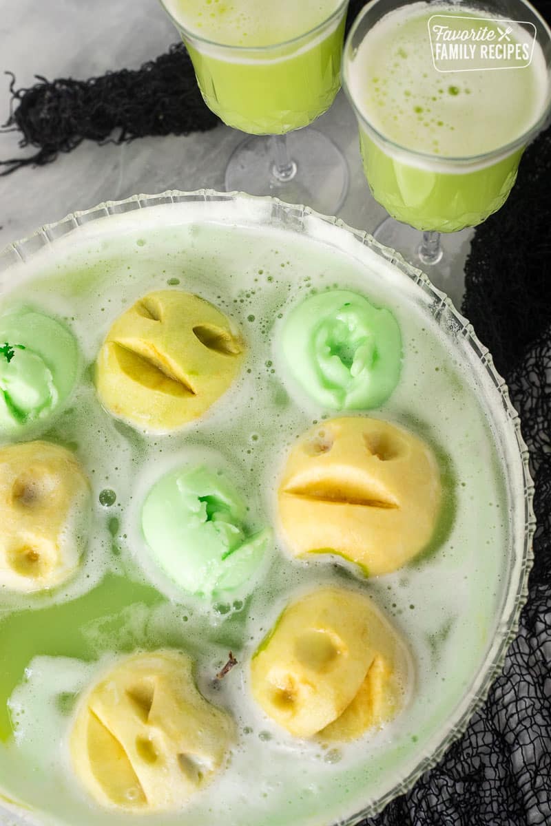 Halloween Punch in a bowl and two glasses.