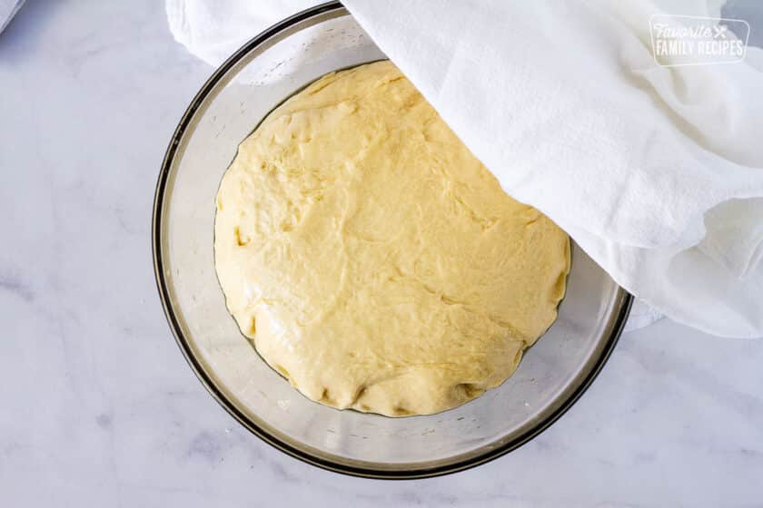 Bowl of dough rising for cinnamon rolls.