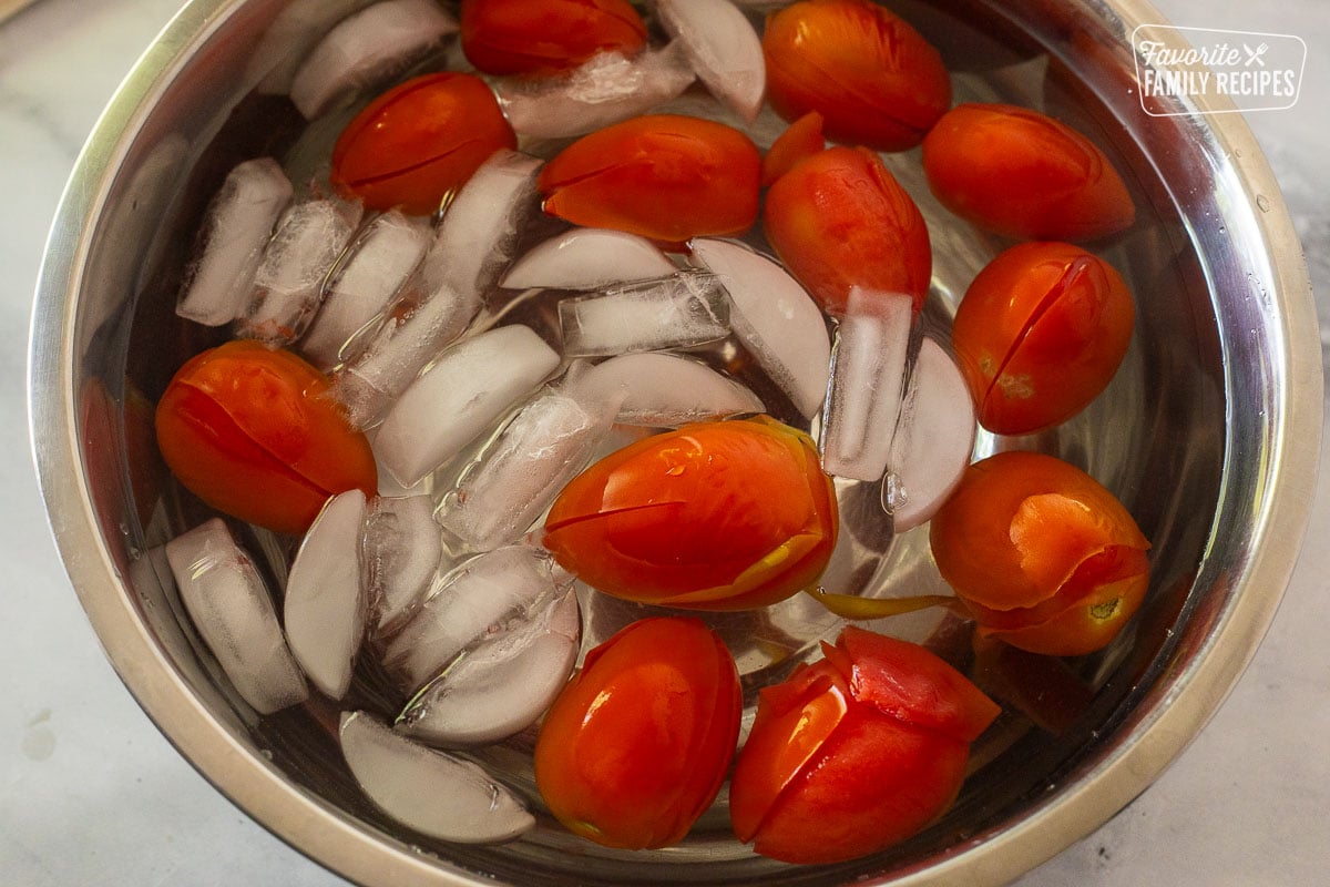 Tomatoes in a bowl of ice water.