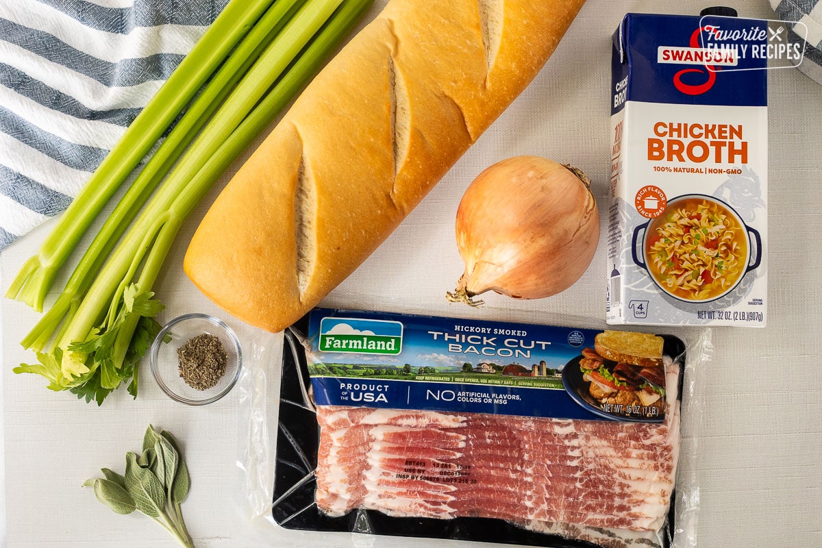 Ingredients to make Bacon Stuffing including bacon, celery, French bread, chicken broth, onion and sage.