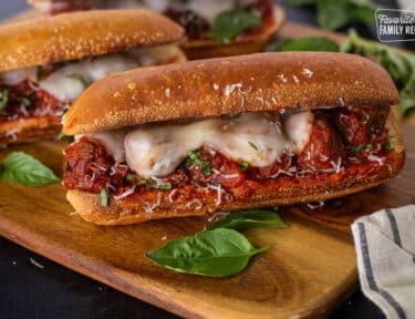 Meatball Sandwich with melted cheese on a toasted roll.