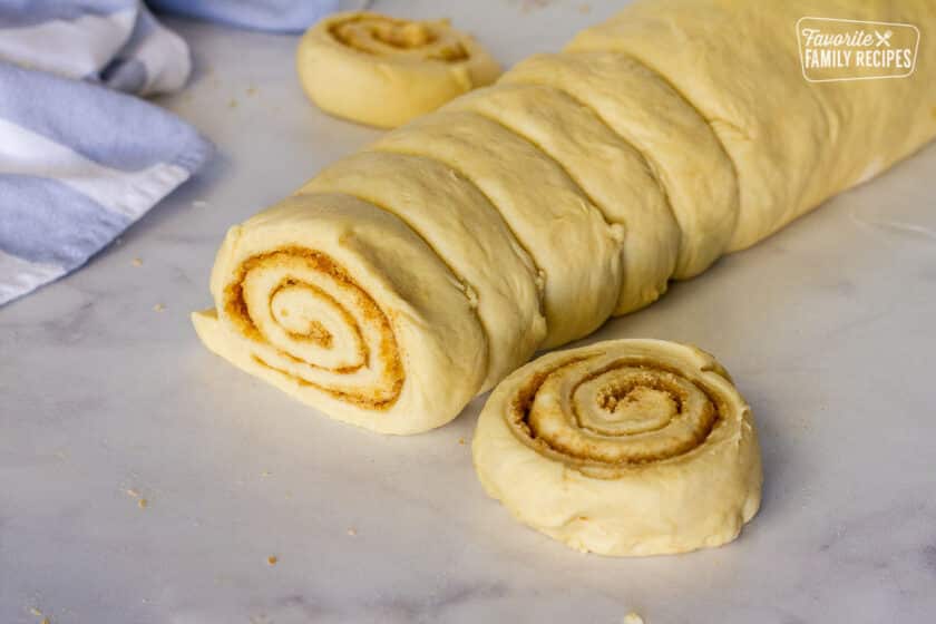 Log of cut out cinnamon rolls.