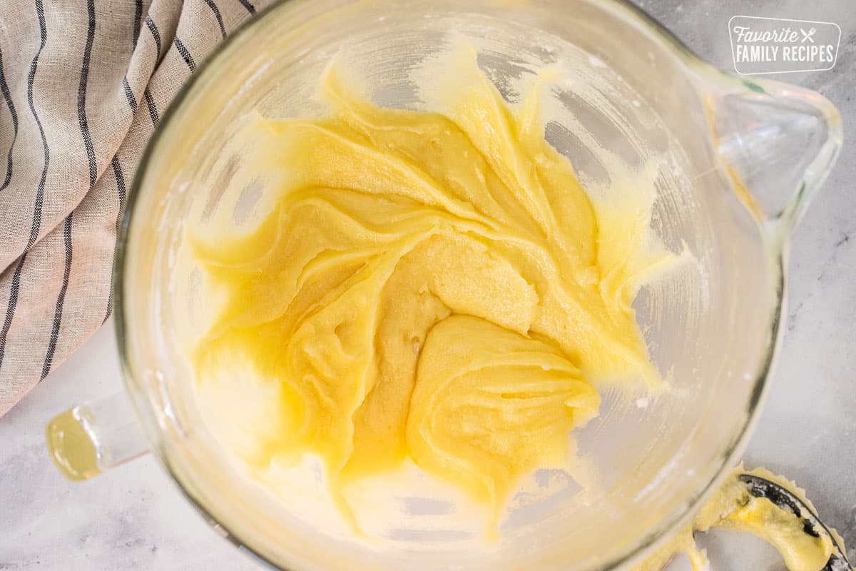 Mixing bowl with creamed shortening and eggs.