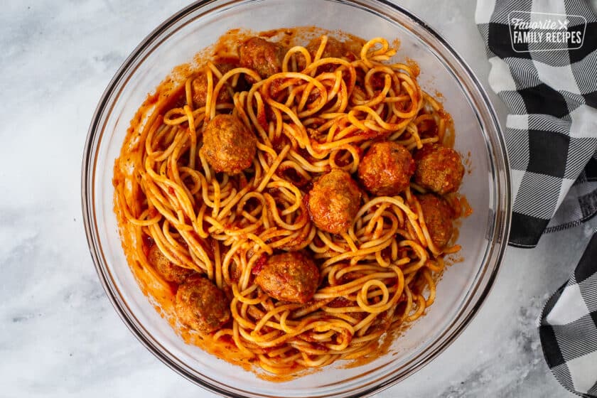 Bowl with mixed spaghetti and meatballs.