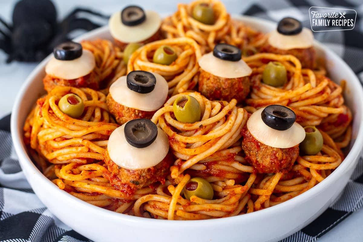 Bowl of Spaghetti and Eyeball Meatballs with green olives.