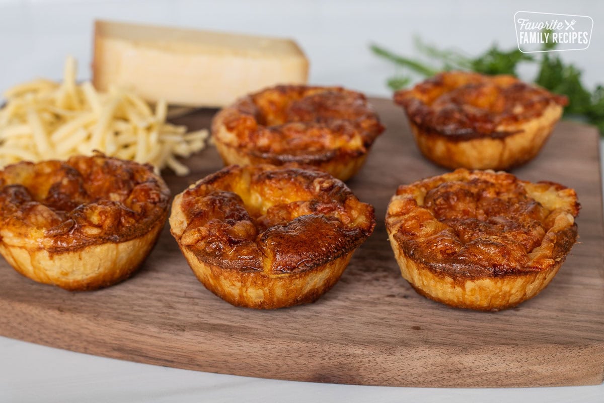 Baked Cheese Pies on a cutting board.