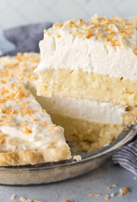 Spatula holding up a slice of Coconut Cream Pie.