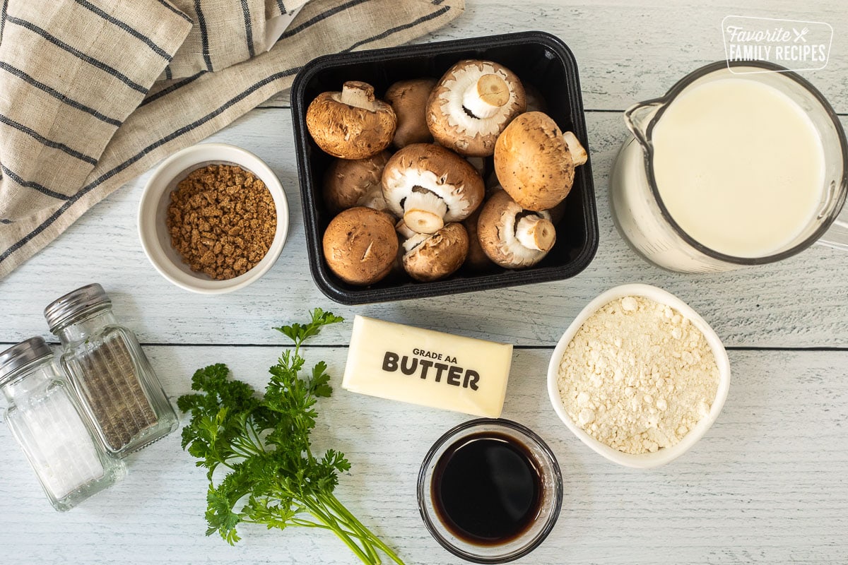 Ingredients to make Condensed Cream of Mushroom Soup including mushrooms, beef bouillon, milk, flour, soy sauce, butter, salt and pepper.