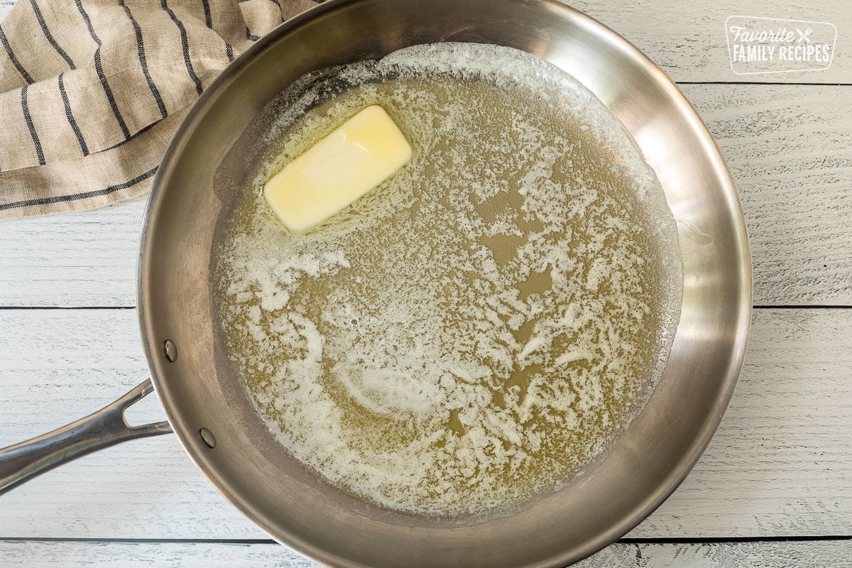 Melting butter in a skillet.